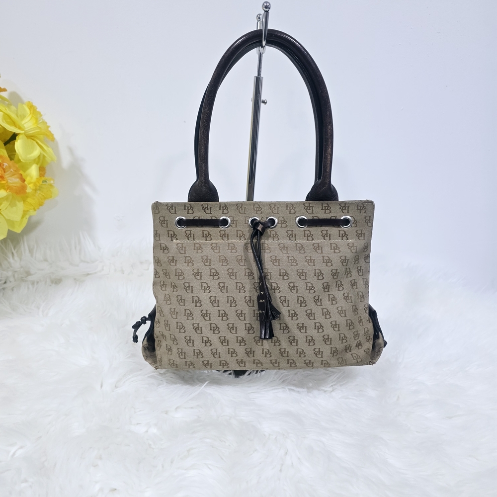 Dooney & Bourke Mini Tassel Tote in tan logo canvas with brown leather